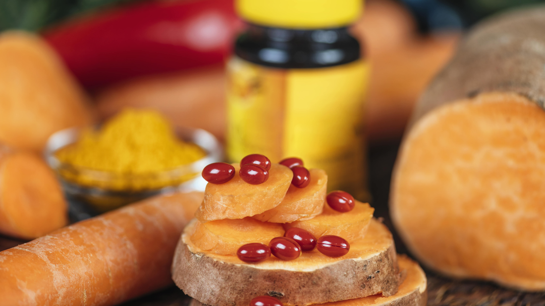 Vitamin B12 supplement capsules on sweet potato slices with carrots, turmeric, and a vitamin bottle, highlighting the importance of B12 for those on plant-based diets.